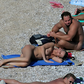Naked Girls and Couples Having Fun at Naturist Beach and one Couple is even Fucking While Others Wat