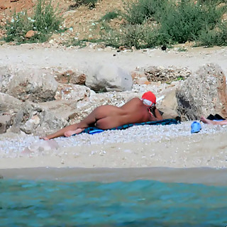 Watch naked girls sunbathing at naturist beaches with open legs so you can observe their pussies bet