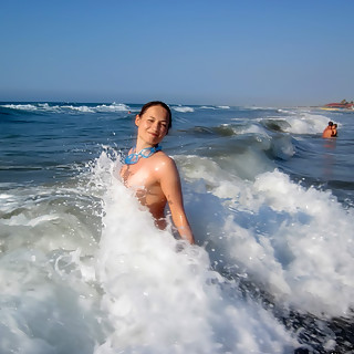 Naturism at the Beach Is a Perfect Place for Pictures of Natural Tits and Smooth Asses in the Ocean 