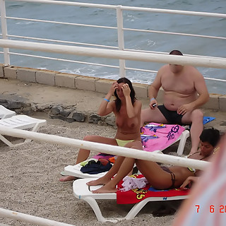 One Older Dude is Wanking His Small Penis on Nude Naturist Girls Who are Sun Bathing with Sweaty Ope