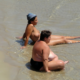 Completely Naked Mature Women Enjoying Their Time with Also Nude Younger Chicks on Naturist Beaches 