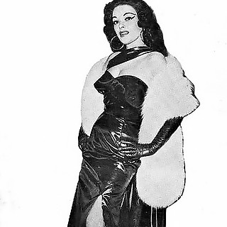Vintage Dame Likes to Look Classy in Evening Gowns and Naughty in Leather Fetish Wear